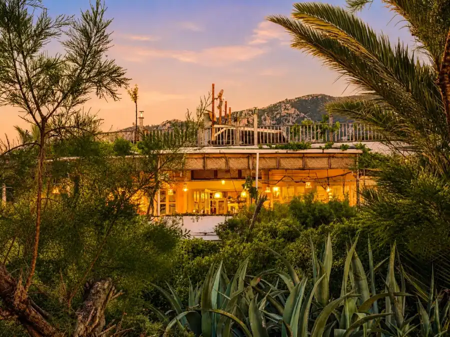 Restaurant glowing at sunset in the gardens